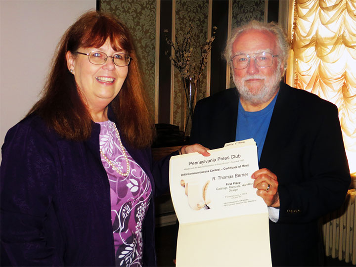 Kay Stephens presents Tom Berner with a first-place award in the Catalogs, Manuals, Handbook Design category at the June 1, 2019 PPC Awards Luncheon.